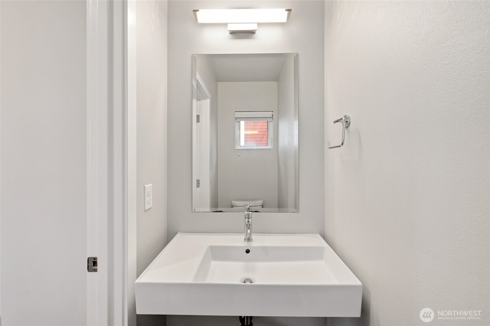 12522 15th Avenue Northeast, Unit B Seattle, WA 98125 - Photo 14 of 40 a bathroom with a sink and a mirror