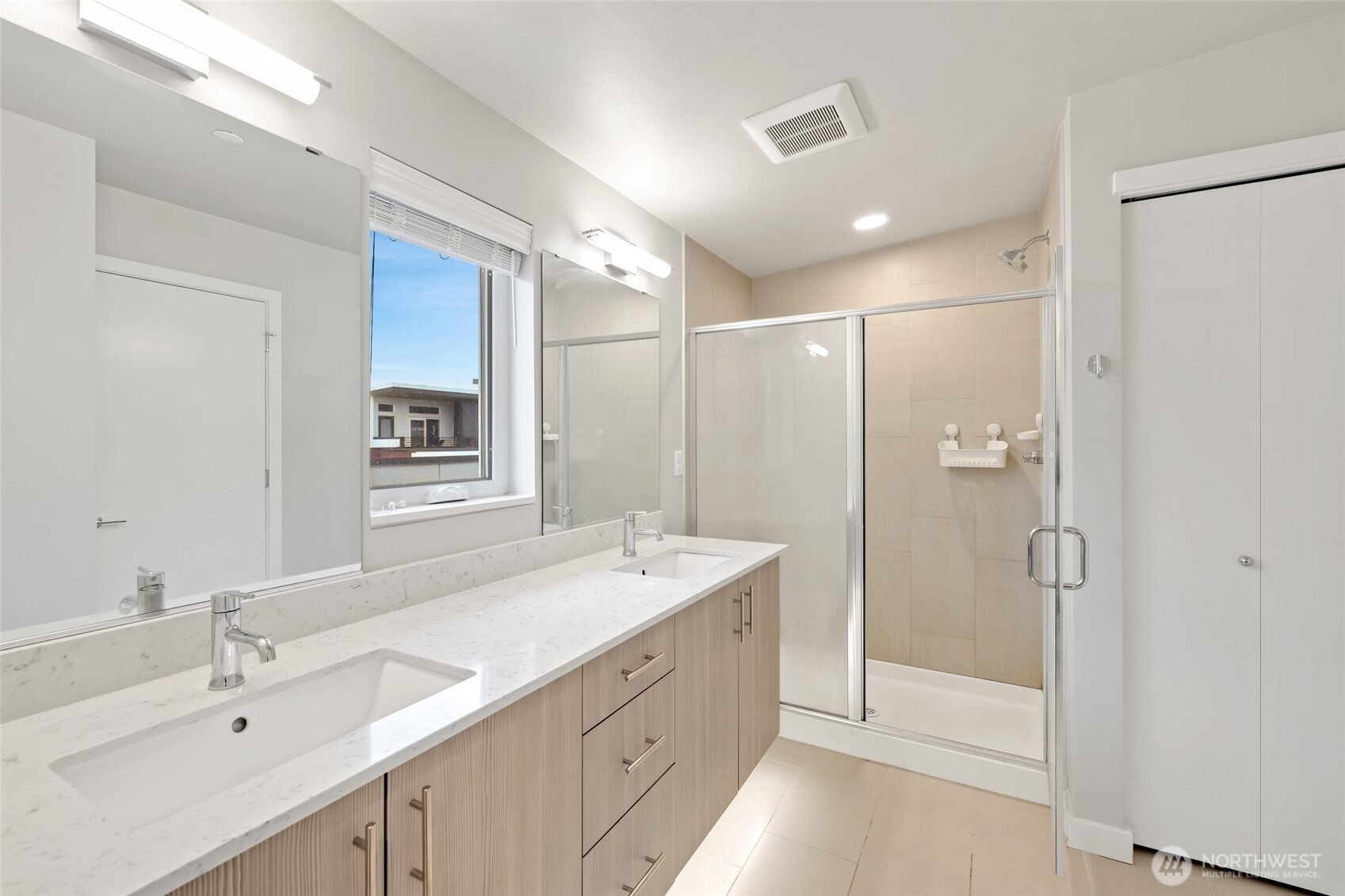 12522 15th Avenue Northeast, Unit B Seattle, WA 98125 - Photo 27 of 40 a spacious bathroom with a shower sink double and mirror