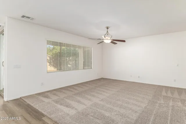 a view of kitchen with refrigerator stove microwave and cabinets