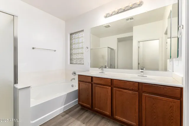 a bathroom with a bathtub and a shower