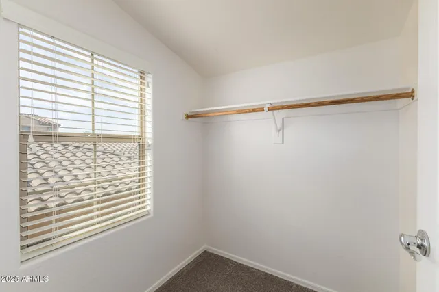 a view of empty room with ceiling fan