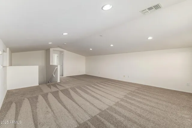 a view of an empty room with windows