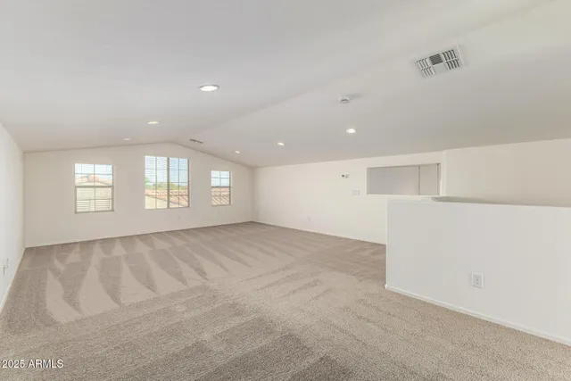 a kitchen with a stove and a refrigerator