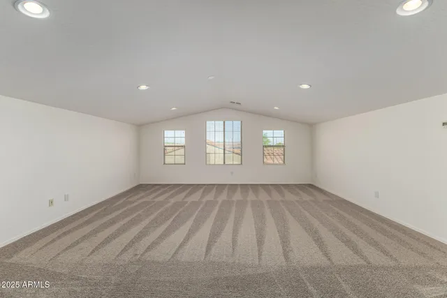 a view of walk in closet with wooden floor