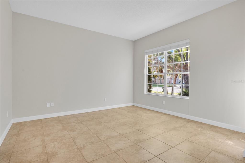 357 Kirkhill Street Ocoee, FL 34761 - Photo 11 of 36 an empty room with windows