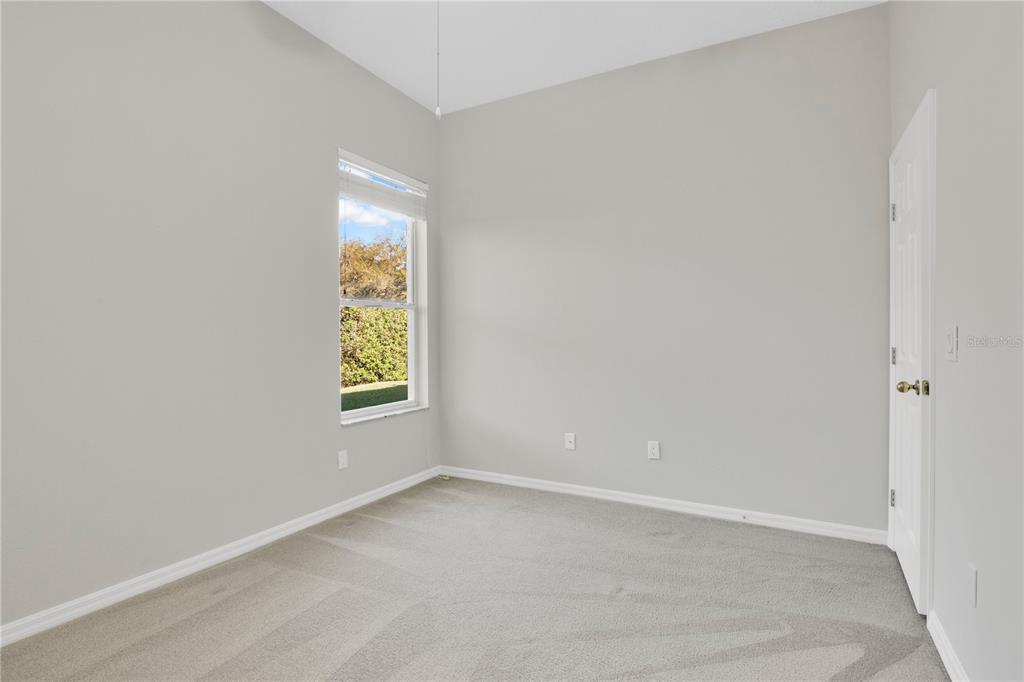 357 Kirkhill Street Ocoee, FL 34761 - Photo 19 of 36 a view of an empty room with a window