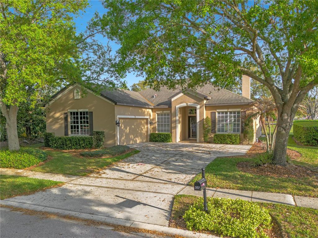357 Kirkhill Street Ocoee, FL 34761 - Photo 25 of 36 a front view of a house with a yard