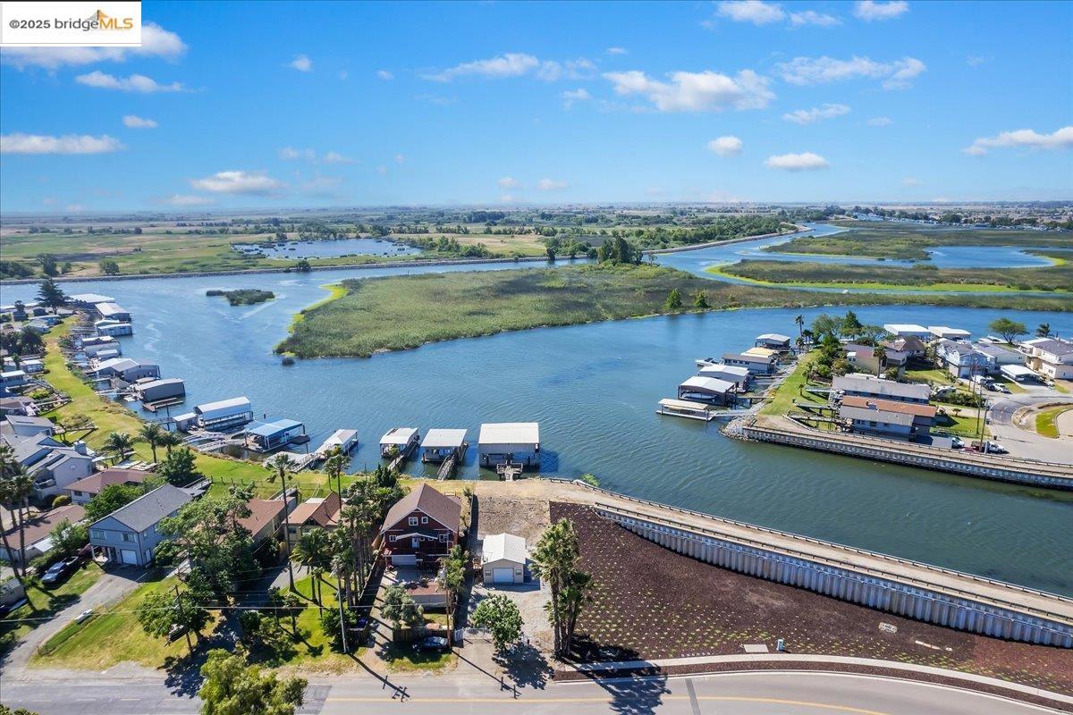 4080 Windsweep Road Bethel Island, CA 94511 - Photo 12 of 18 a view of a lake with a table and chairs