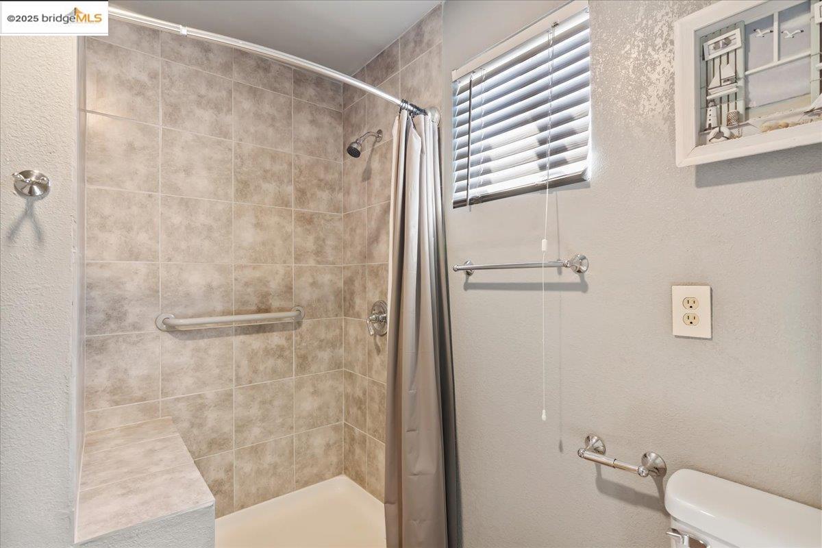 4080 Windsweep Road Bethel Island, CA 94511 - Photo 4 of 18 a bathroom with a shower and a toilet