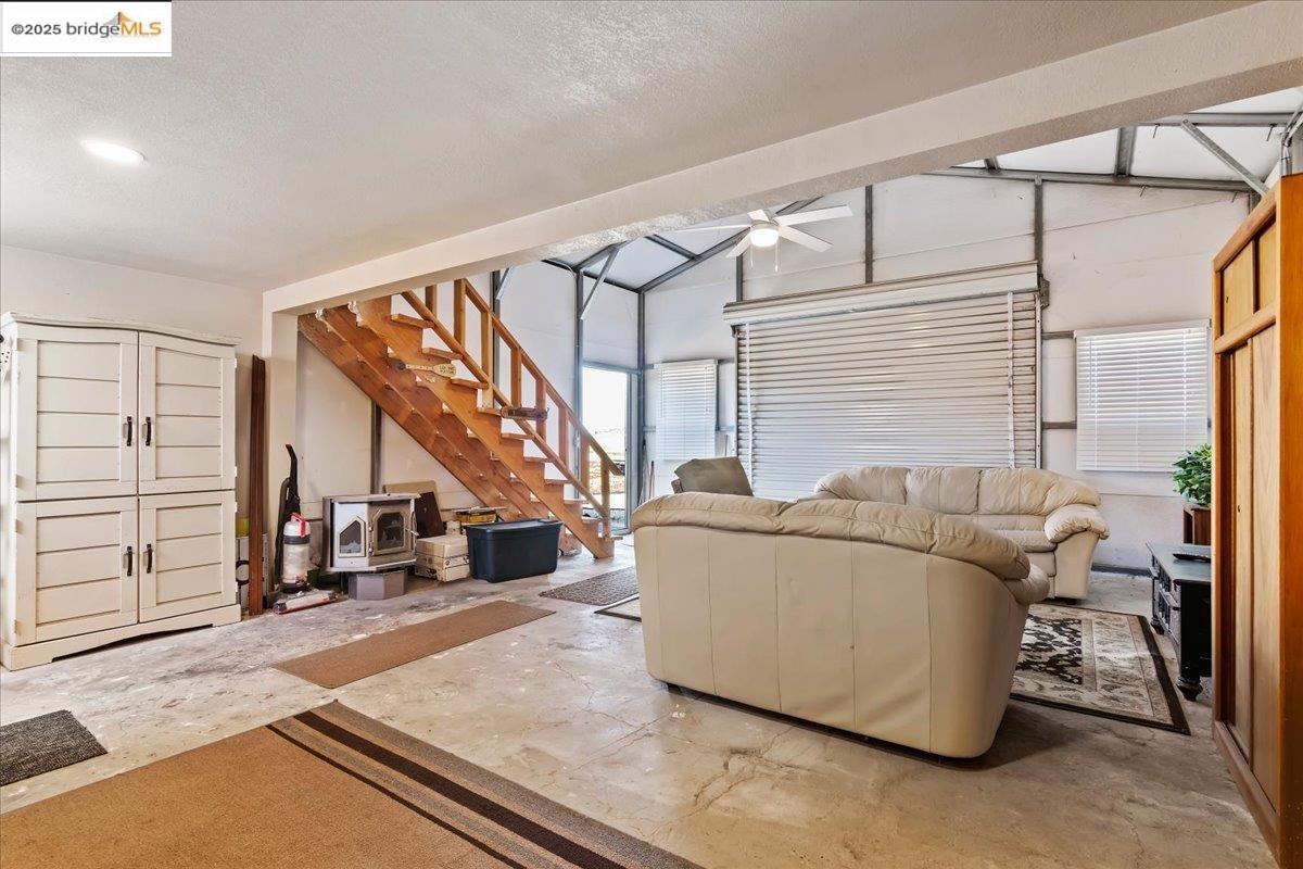 4080 Windsweep Road Bethel Island, CA 94511 - Photo 5 of 18 a living room with furniture and a ceiling fan