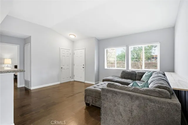 a living room with a couch and a large window