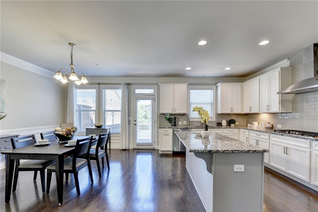 4158 Butler Drive Atlanta, GA 30341 - Photo 17 of 65 a kitchen with granite countertop lots of counter top space dining table and stainless steel appliances