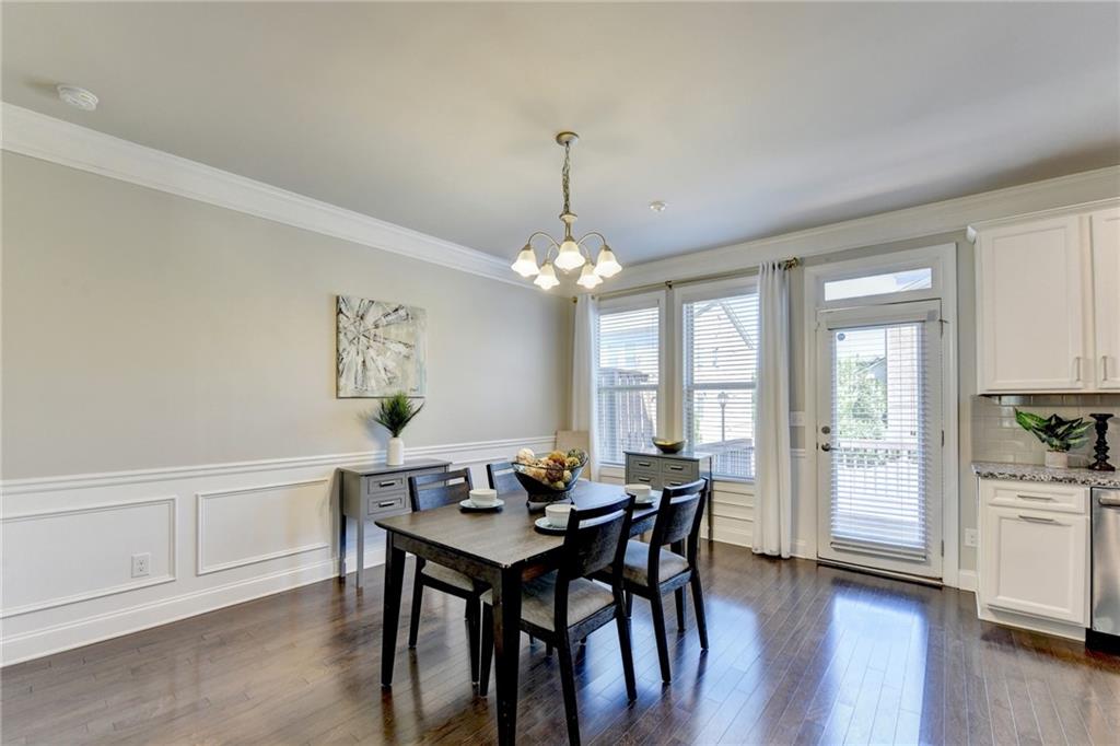 4158 Butler Drive Atlanta, GA 30341 - Photo 18 of 65 a dining room with furniture a chandelier and wooden floor