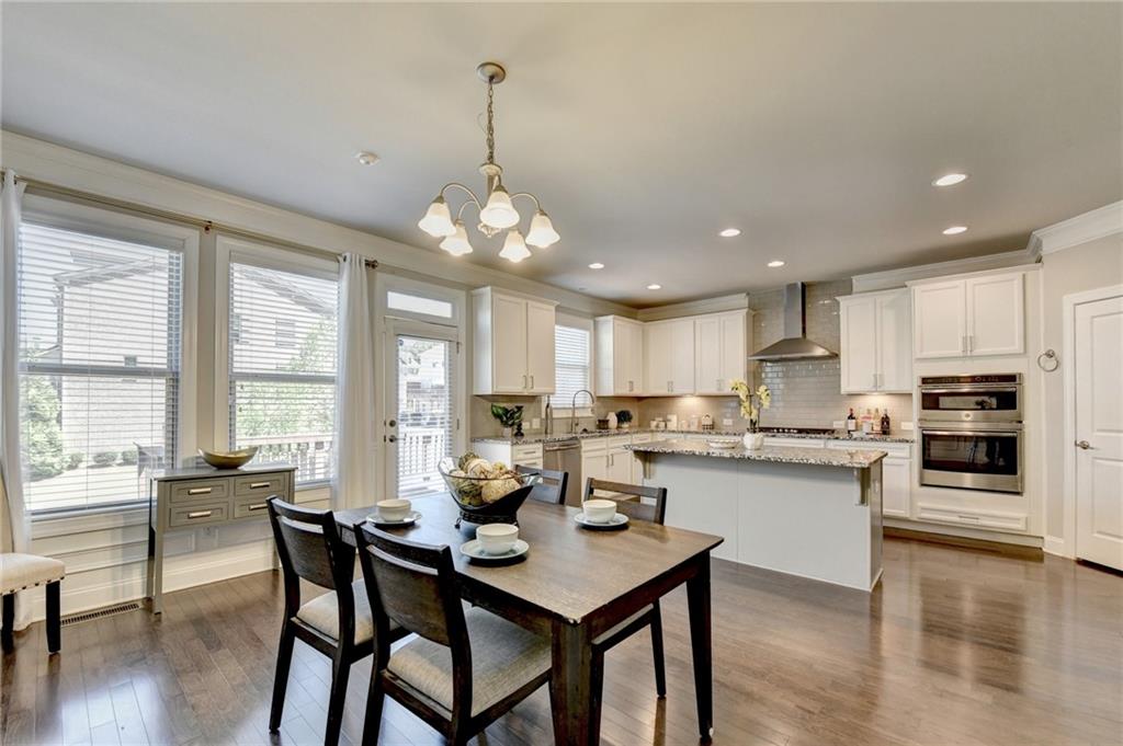 4158 Butler Drive Atlanta, GA 30341 - Photo 20 of 65 a view of a dining room and livingroom with furniture wooden floor a chandelier