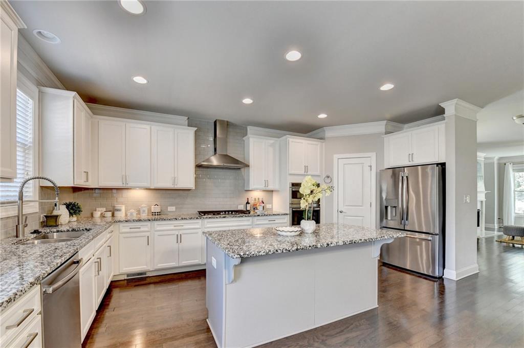 4158 Butler Drive Atlanta, GA 30341 - Photo 24 of 65 a kitchen with stainless steel appliances granite countertop a refrigerator sink and cabinets