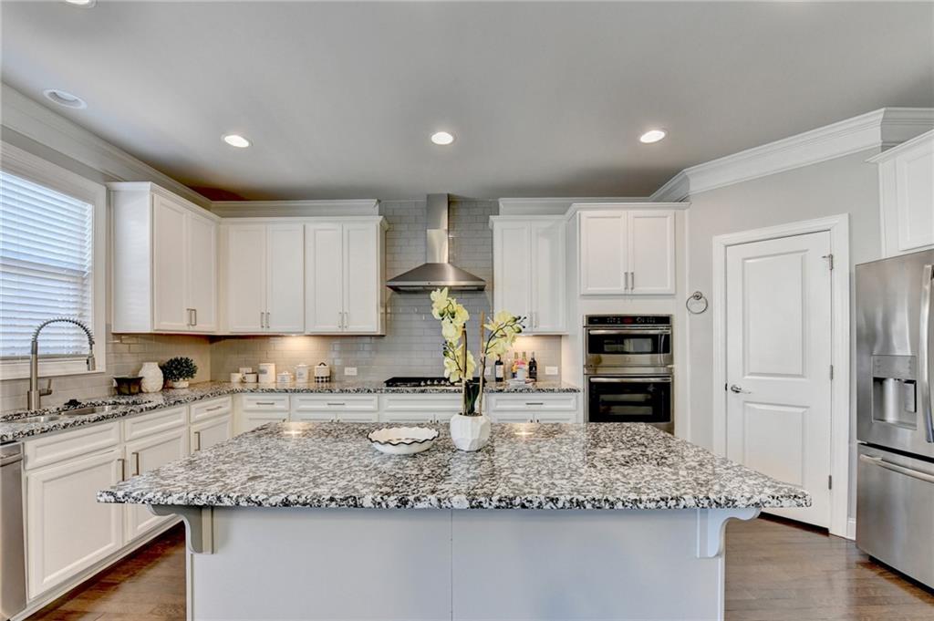 4158 Butler Drive Atlanta, GA 30341 - Photo 25 of 65 a kitchen with stainless steel appliances granite countertop a sink refrigerator and cabinets