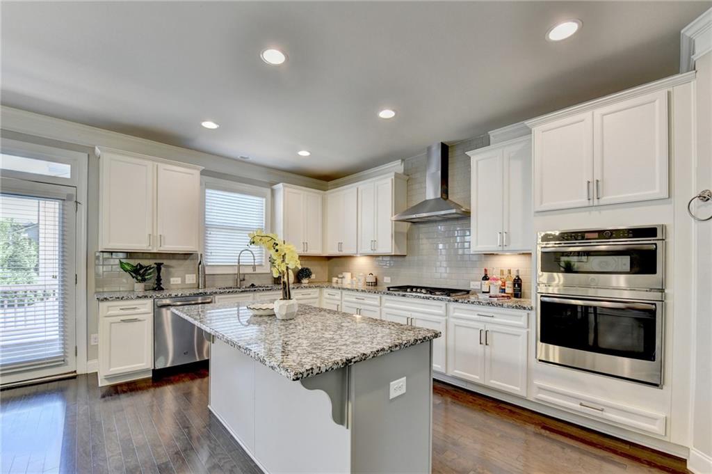 4158 Butler Drive Atlanta, GA 30341 - Photo 26 of 65 a kitchen with stainless steel appliances granite countertop a sink stove and cabinets