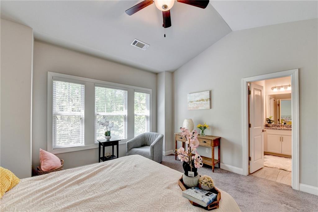 4158 Butler Drive Atlanta, GA 30341 - Photo 41 of 65 a bedroom with a bed and a chandelier