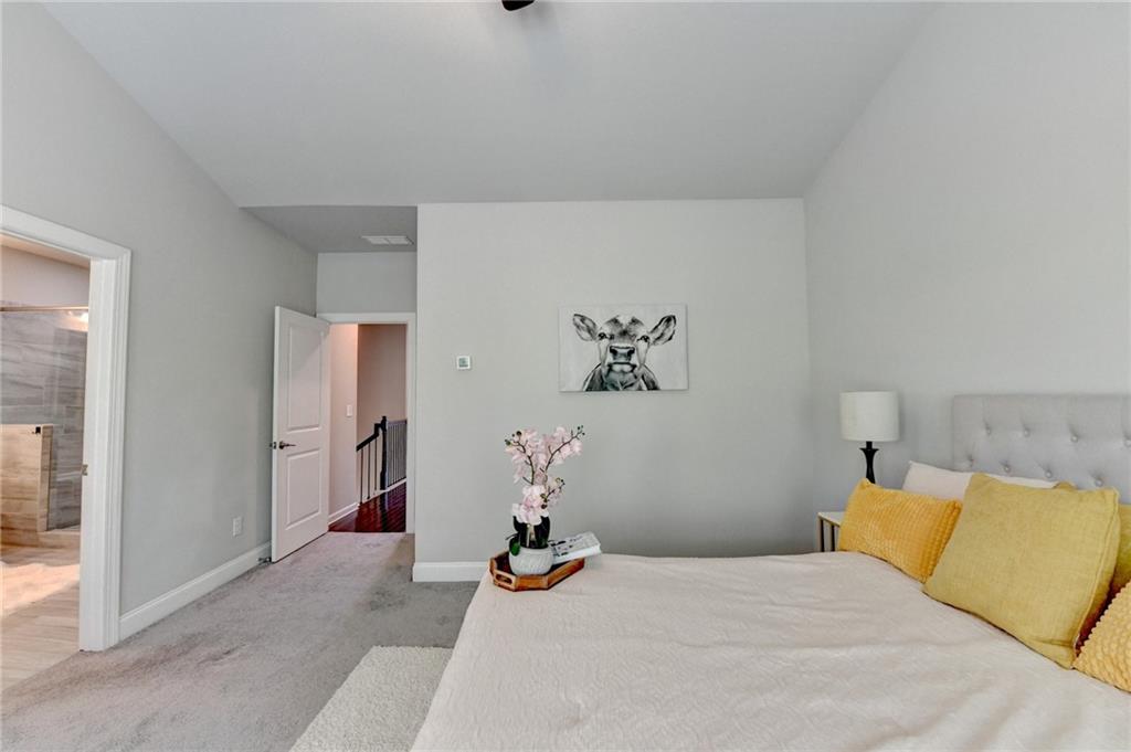 4158 Butler Drive Atlanta, GA 30341 - Photo 42 of 65 a bedroom with a bed and a couch