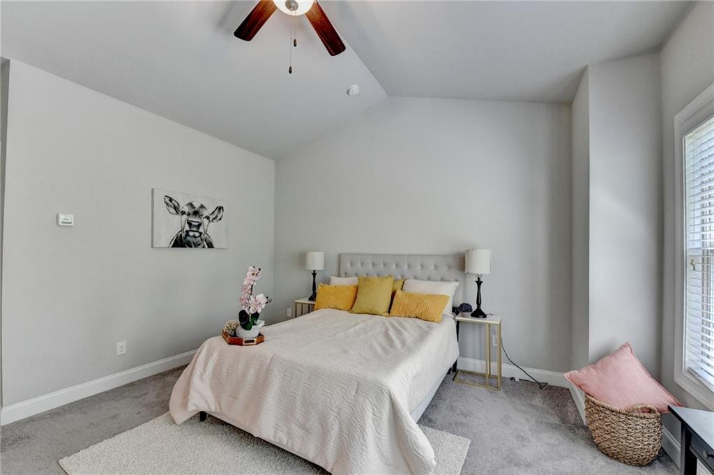 4158 Butler Drive Atlanta, GA 30341 - Photo 43 of 65 a bedroom with a bed and painting on the wall