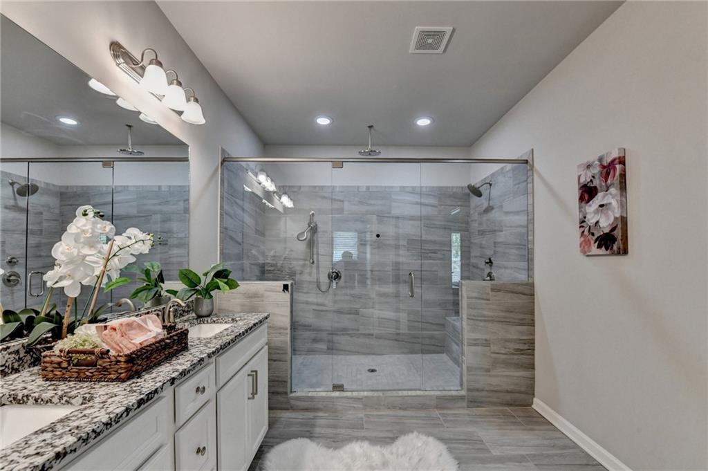 4158 Butler Drive Atlanta, GA 30341 - Photo 46 of 65 a bathroom with a shower sink and mirror