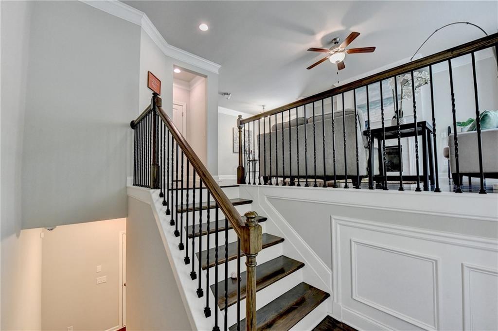 4158 Butler Drive Atlanta, GA 30341 - Photo 5 of 65 a view of staircase with lots of frames on wall and a window