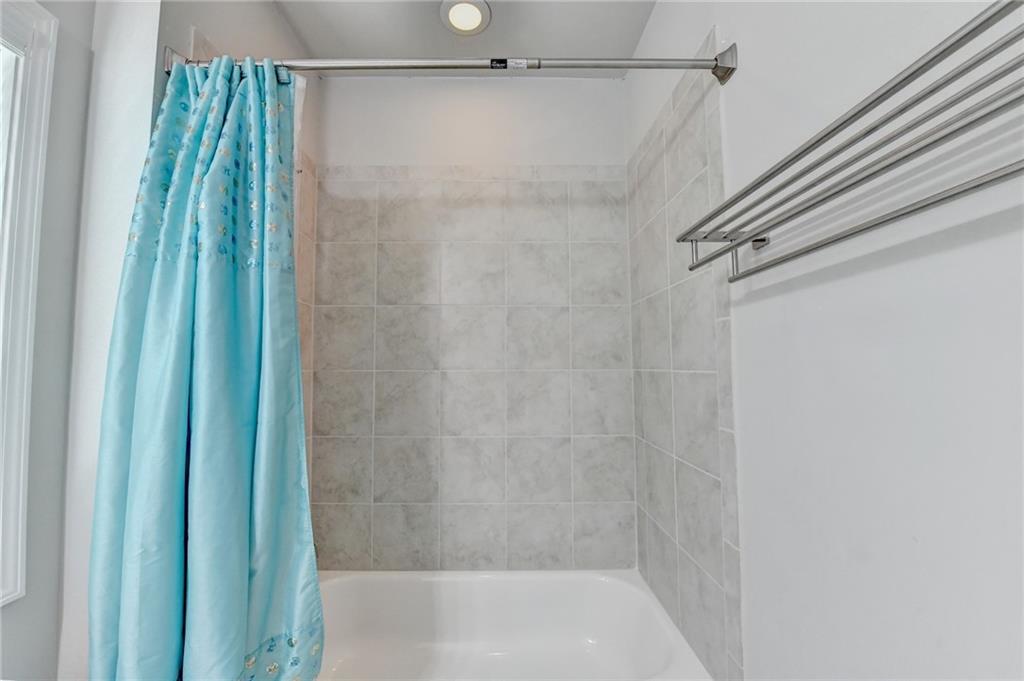 4158 Butler Drive Atlanta, GA 30341 - Photo 52 of 65 a bathroom with a shower and a tub