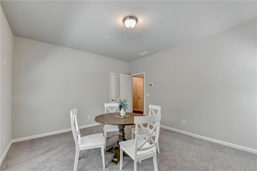 4158 Butler Drive Atlanta, GA 30341 - Photo 58 of 65 a dining room with furniture and wooden floor
