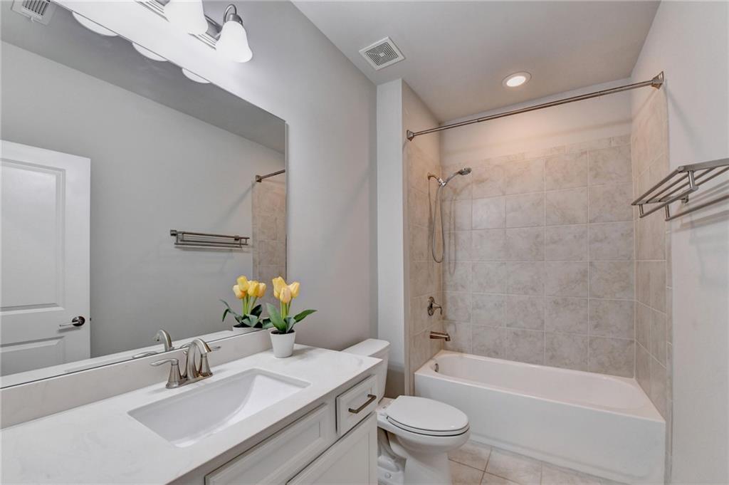 4158 Butler Drive Atlanta, GA 30341 - Photo 59 of 65 a bathroom with a sink a toilet and shower