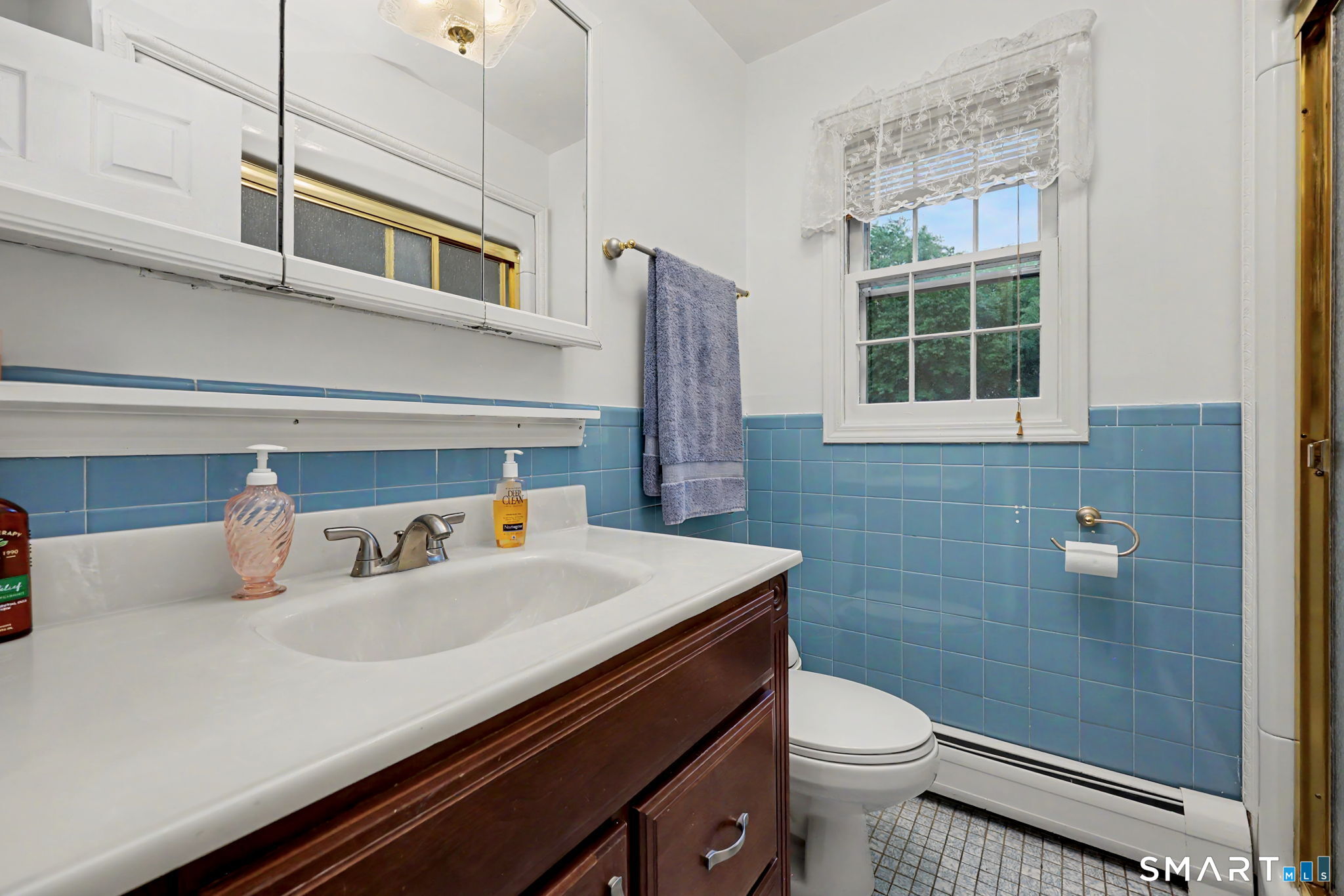 571 Wheeler Road Monroe, CT 06468 - Photo 22 of 40 a bathroom with a sink a toilet and shower