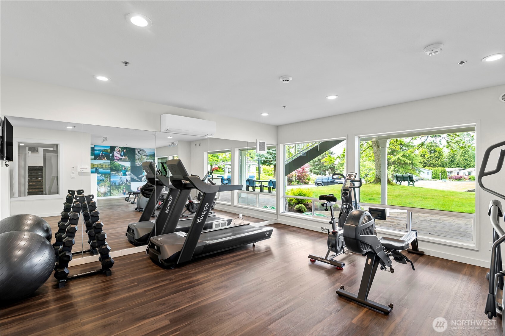 1427 100th Street Southwest, Unit 145 Everett, WA 98204 - Photo 11 of 36 a view of a room with gym equipment and large windows