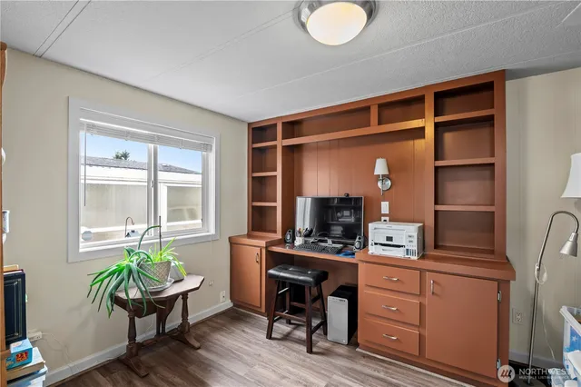 a workspace with furniture and window