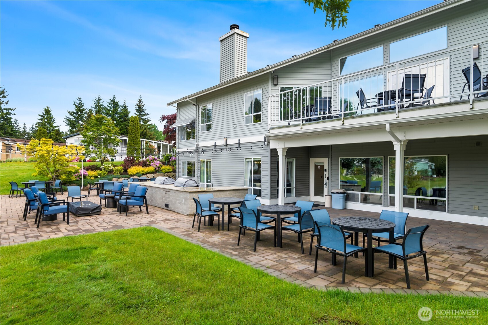 1427 100th Street Southwest, Unit 145 Everett, WA 98204 - Photo 7 of 36 a view of a house with a backyard and sitting area