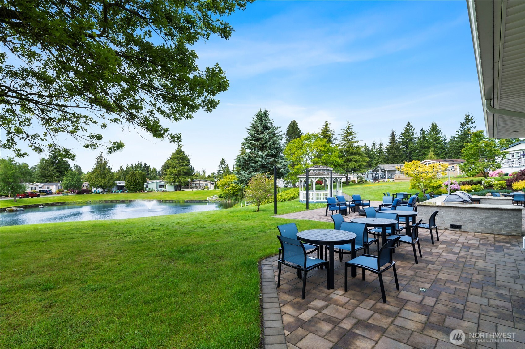 1427 100th Street Southwest, Unit 145 Everett, WA 98204 - Photo 8 of 36 a view of a chairs and table in the garden