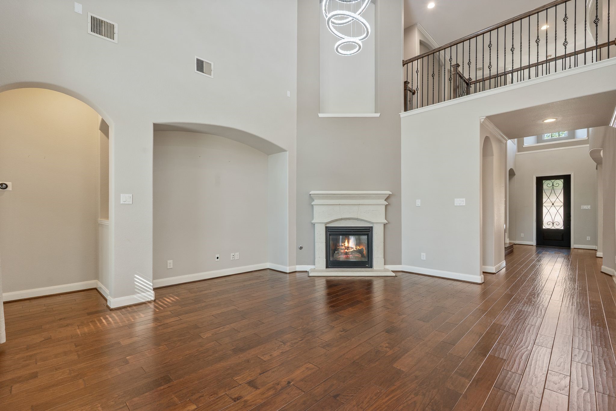 166 Lindenberry Circle Tomball, TX 77375 - Photo 11 of 43 Upstairs opens to 1st floor. The catwalk separates 2 bedroom on one side and a gameroom and guest room on the other!