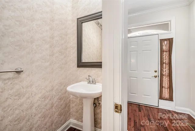 a bathroom with a sink and mirror