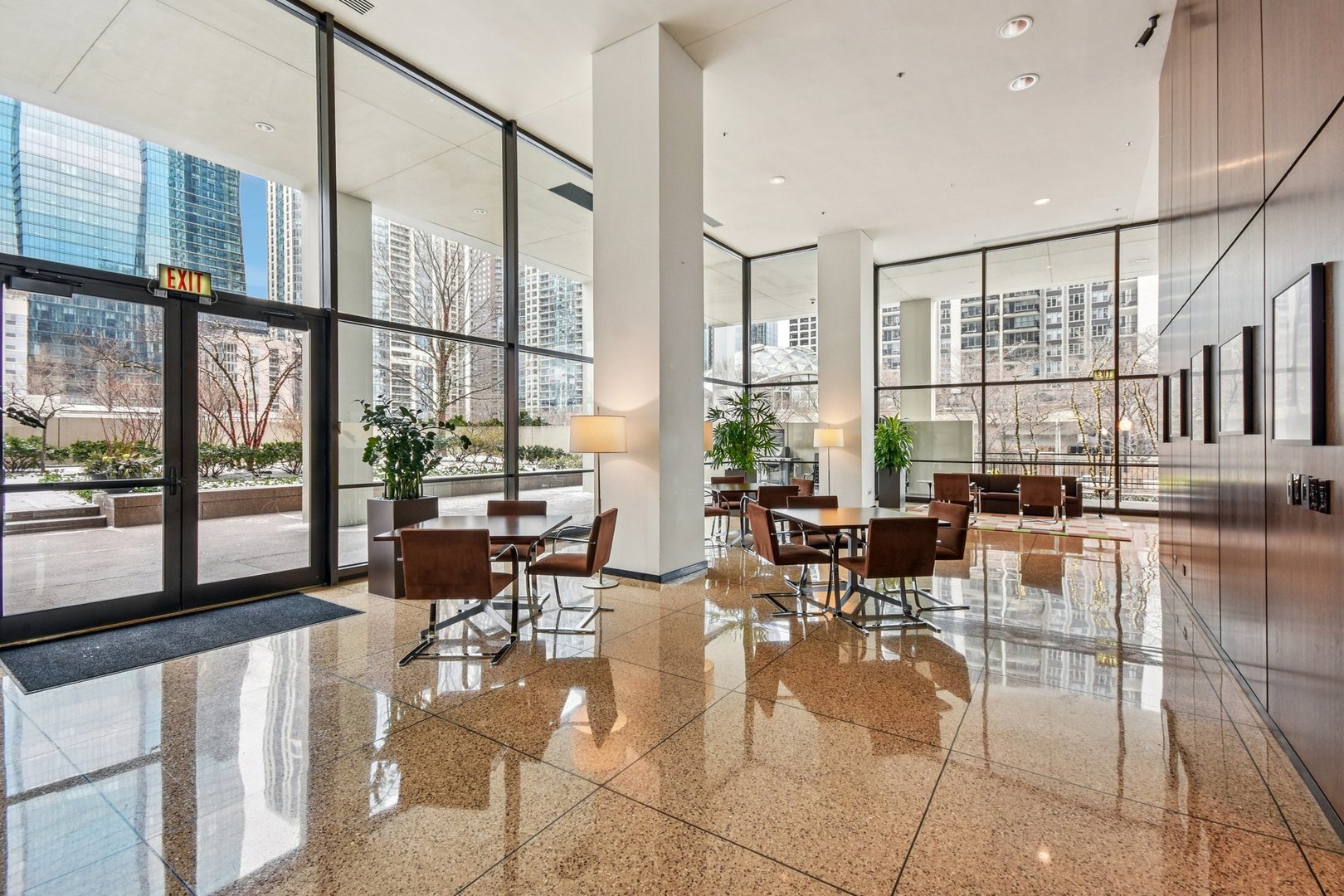 360 East Randolph Street, Unit 1102 Chicago, IL 60601 - Photo 18 of 27 a living room with fireplace furniture and floor to ceiling windows