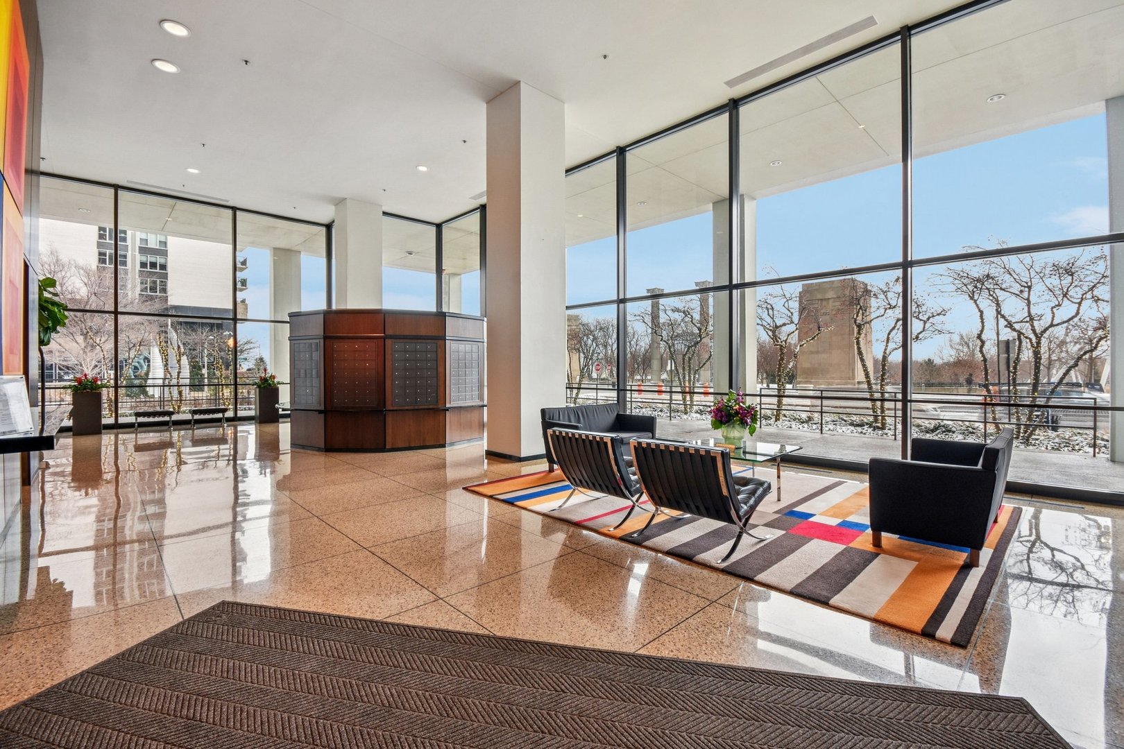 360 East Randolph Street, Unit 1102 Chicago, IL 60601 - Photo 19 of 27 a living room with furniture and a floor to ceiling window