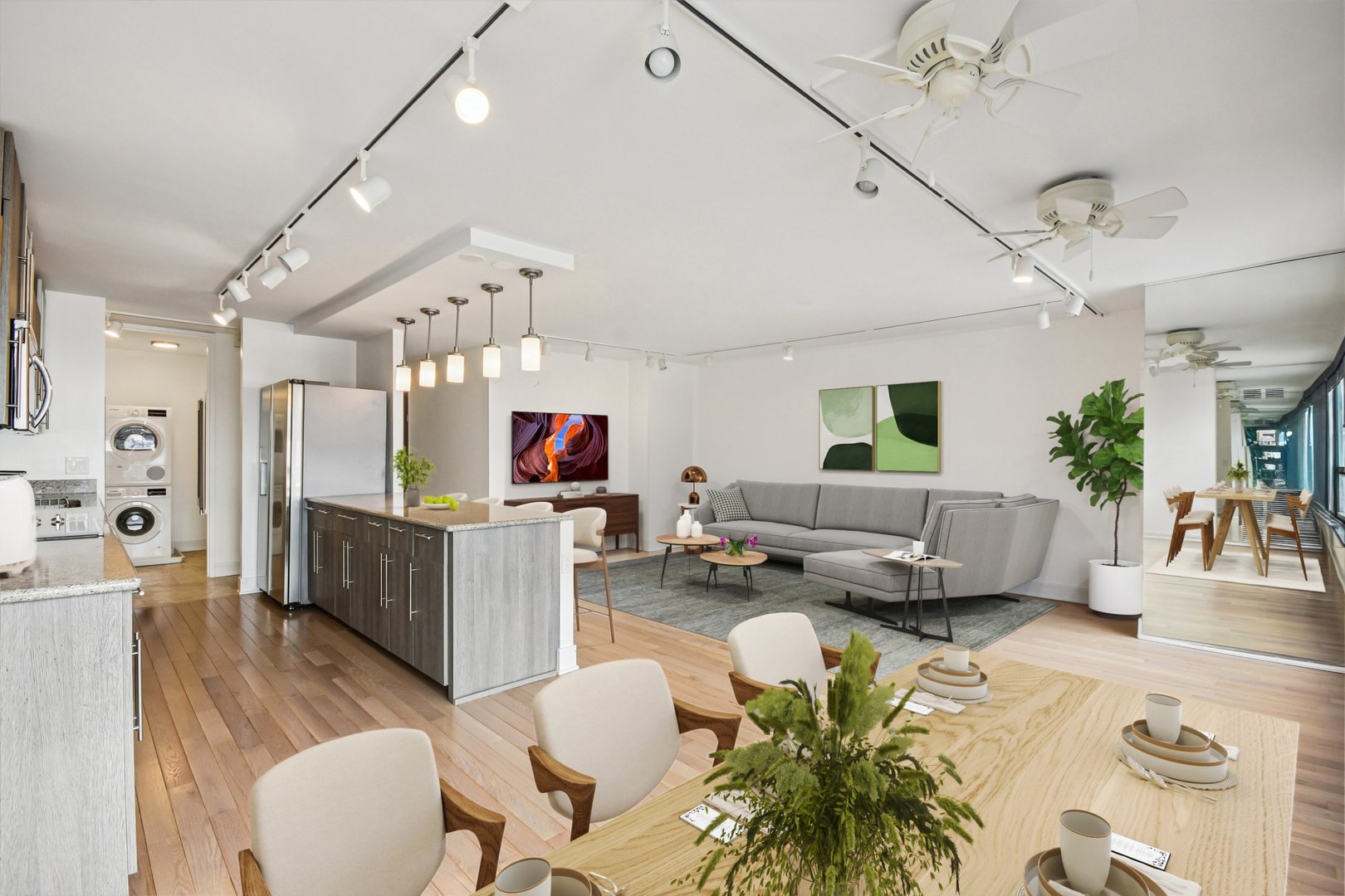 360 East Randolph Street, Unit 1102 Chicago, IL 60601 - Photo 3 of 27 a living room with furniture kitchen view and a wooden floor
