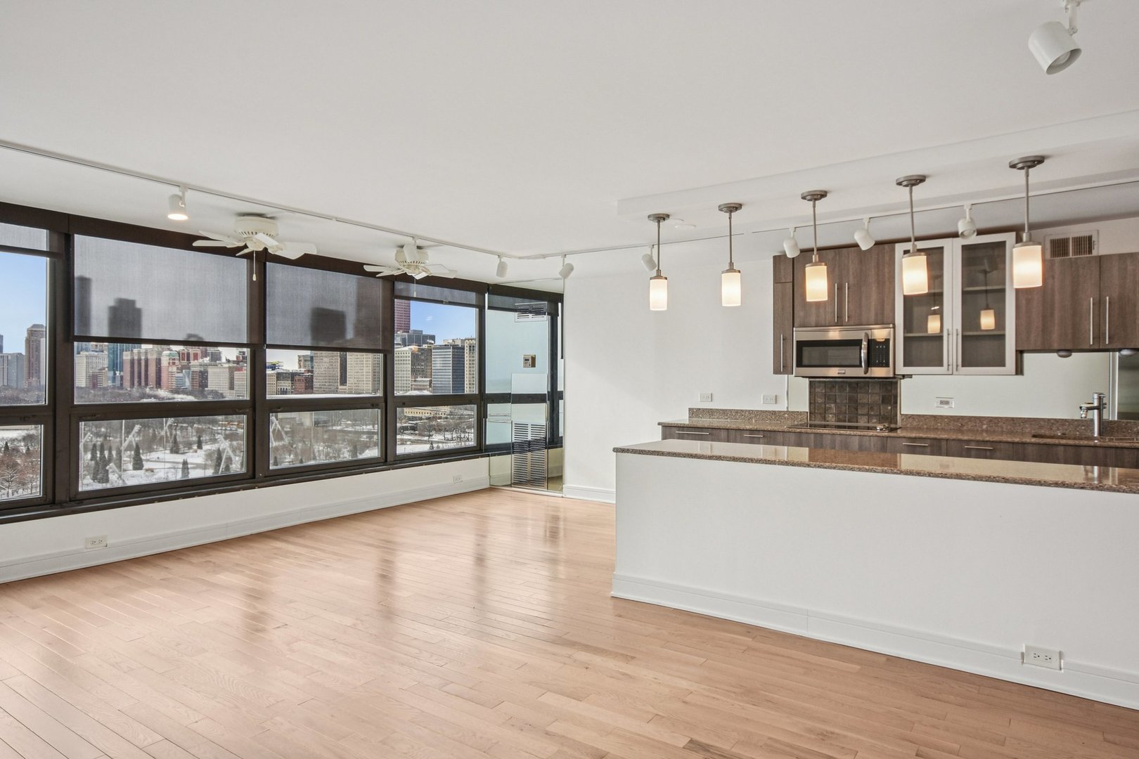 360 East Randolph Street, Unit 1102 Chicago, IL 60601 - Photo 5 of 27 a large white kitchen with a large window