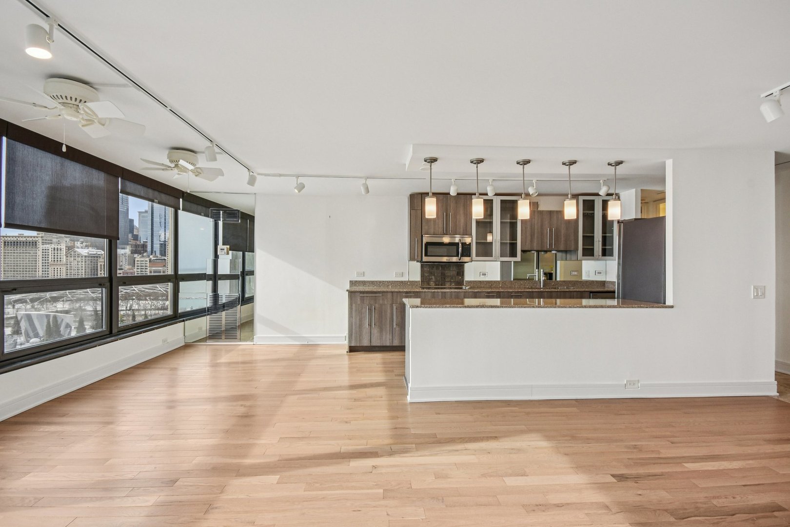 360 East Randolph Street, Unit 1102 Chicago, IL 60601 - Photo 6 of 27 a view of a living room with kitchen