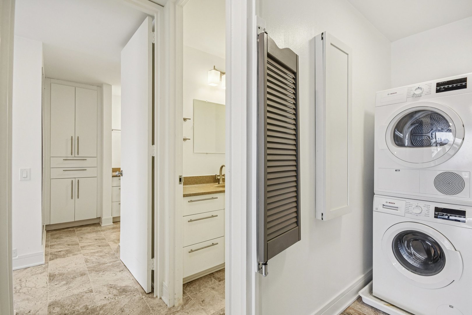 360 East Randolph Street, Unit 1102 Chicago, IL 60601 - Photo 9 of 27 a view of bathroom with washer and dryer