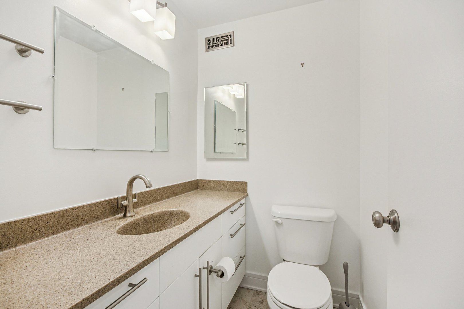 360 East Randolph Street, Unit 1102 Chicago, IL 60601 - Photo 10 of 27 a bathroom with a toilet sink and mirror