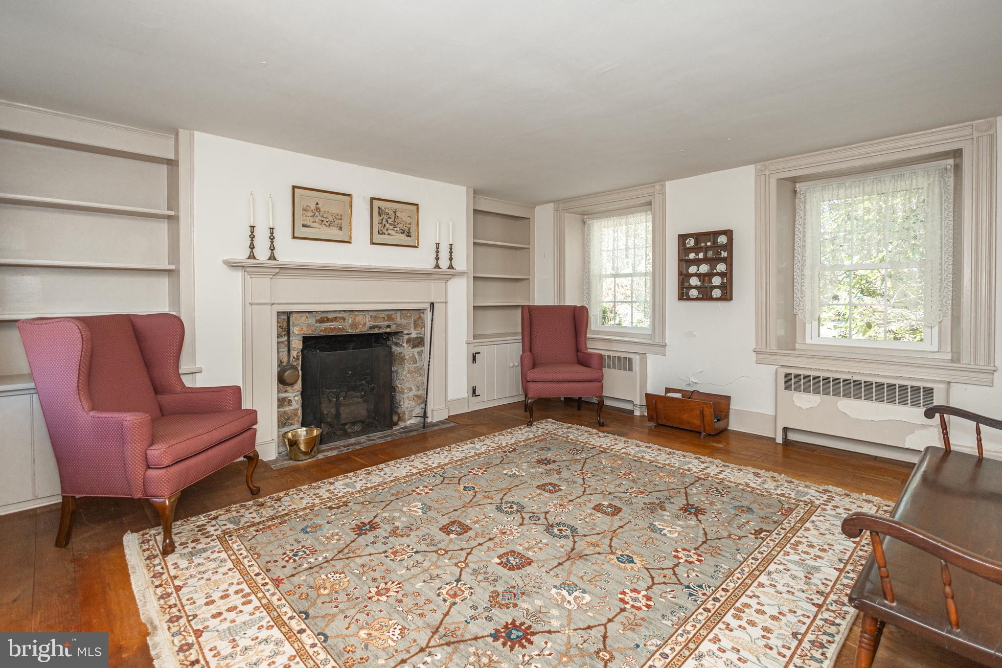 2209 Swamp Road Furlong, PA 18925 - Photo 11 of 59 a living room with furniture windows and a fireplace