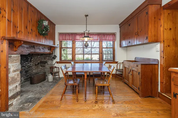 a kitchen with stainless steel appliances kitchen island granite countertop a sink and cabinets