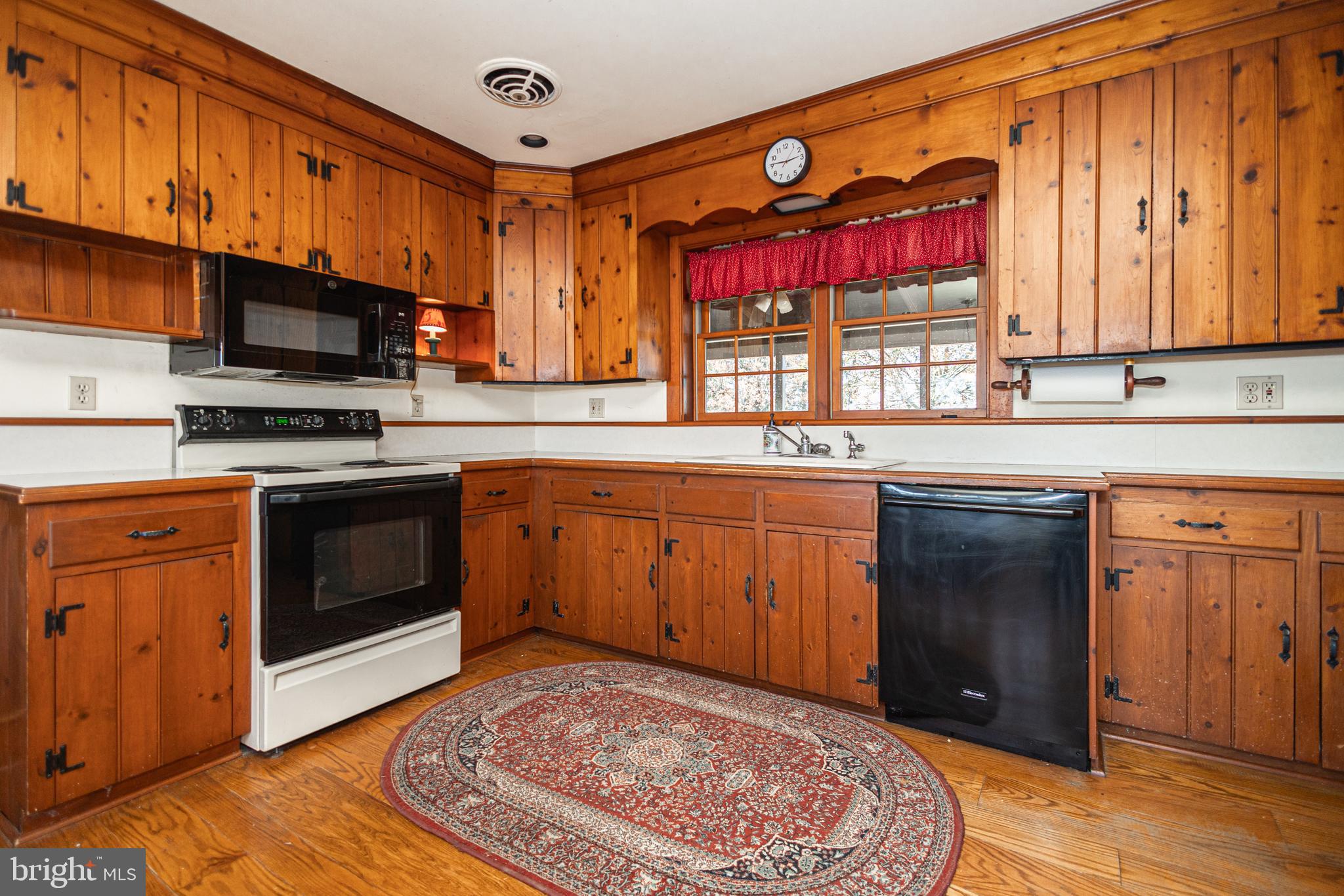 2209 Swamp Road Furlong, PA 18925 - Photo 17 of 59 a kitchen with stainless steel appliances granite countertop a stove sink and cabinets