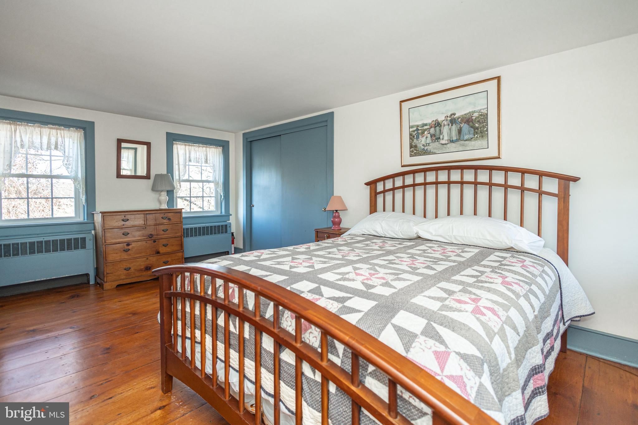 2209 Swamp Road Furlong, PA 18925 - Photo 22 of 59 a bedroom with a bed a dresser and a window