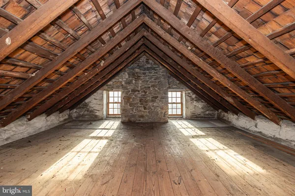 a bedroom with furniture and a flat screen tv