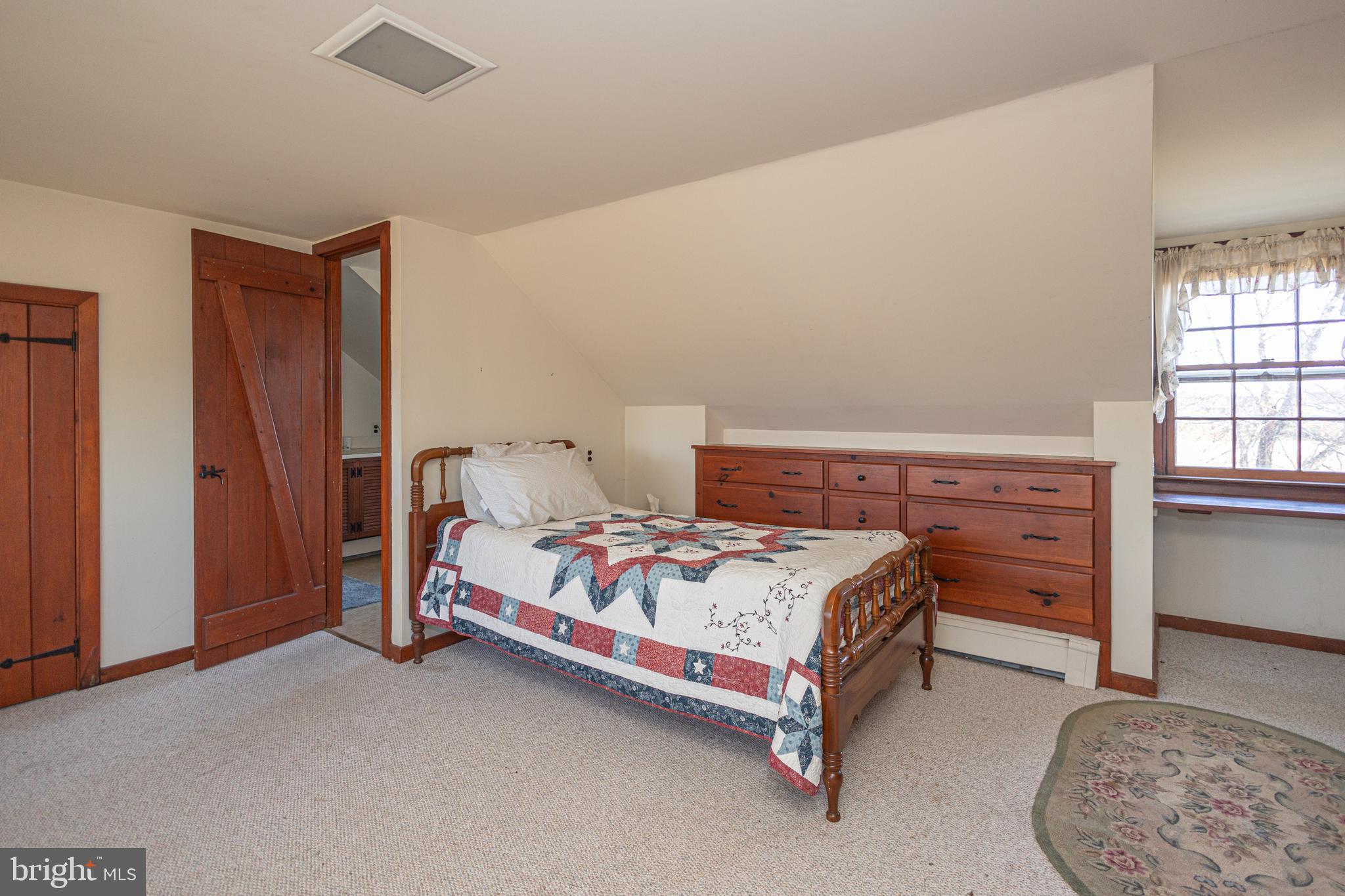 2209 Swamp Road Furlong, PA 18925 - Photo 39 of 59 a bedroom with a bed and a window