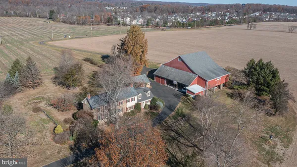 an aerial view of a house with a lake view